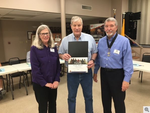 Grand Knight Gary Wolfer presenting the 2024 March Family of the Month Award to Mike and Carolyn Nee