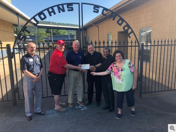 Pictured above from Left to Right: GK Ed Doyle, Charlie Cook, Scott Krantz, Fr. George Sanders, Fr. Ravi Gudipalli and Principal Janet Edgar